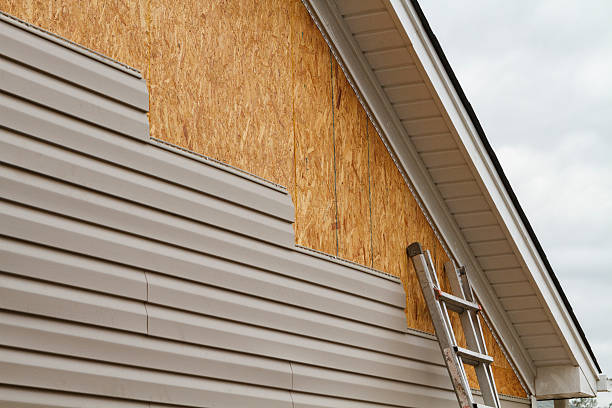 Professional Storm Damage Siding Repair technician working in Hightstown, NJ